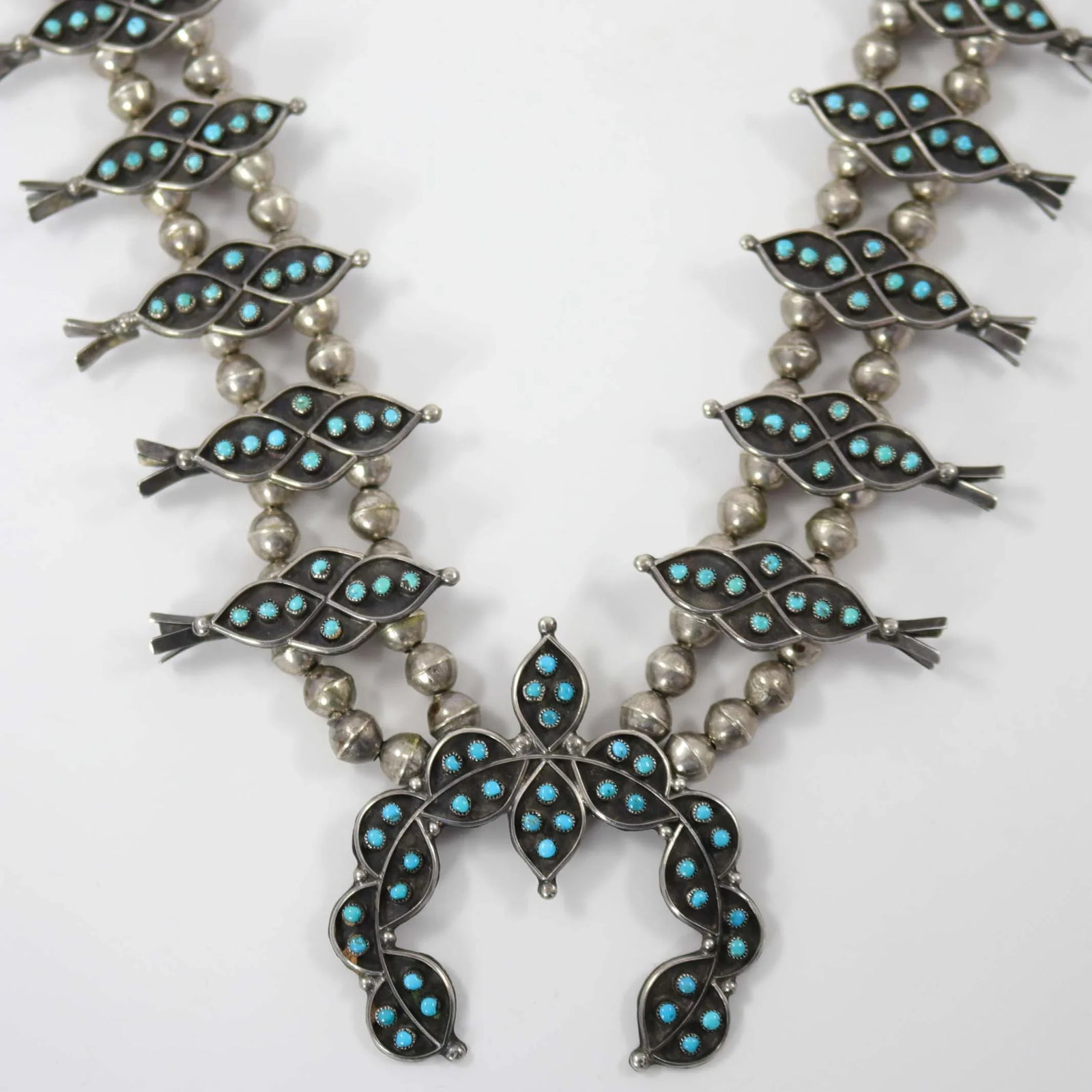 1960s Turquoise Snake Eye Squash Blossom by Vintage Collection - Garland's