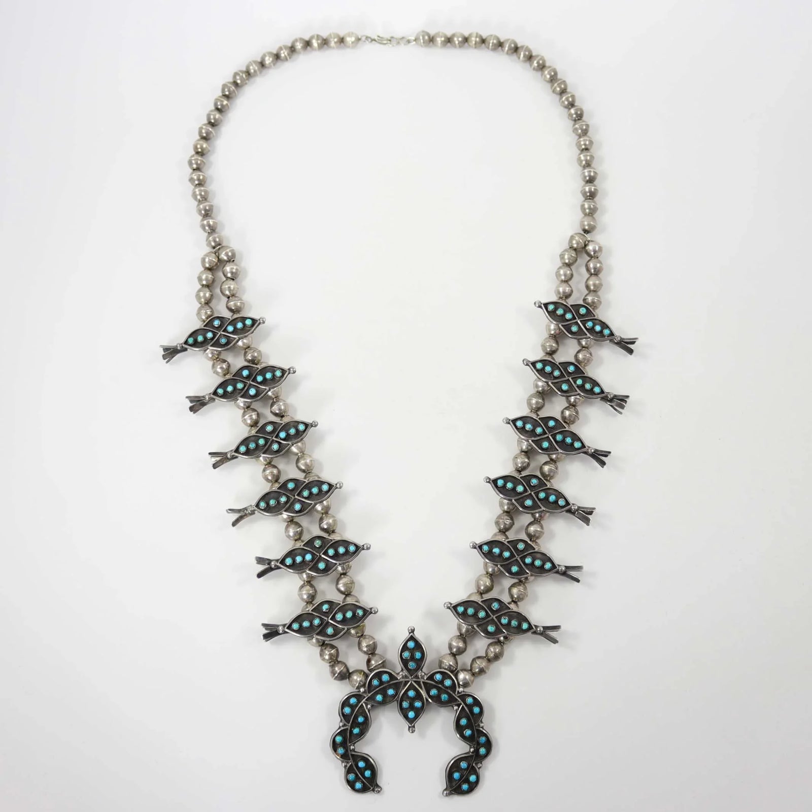 1960s Turquoise Snake Eye Squash Blossom by Vintage Collection - Garland's