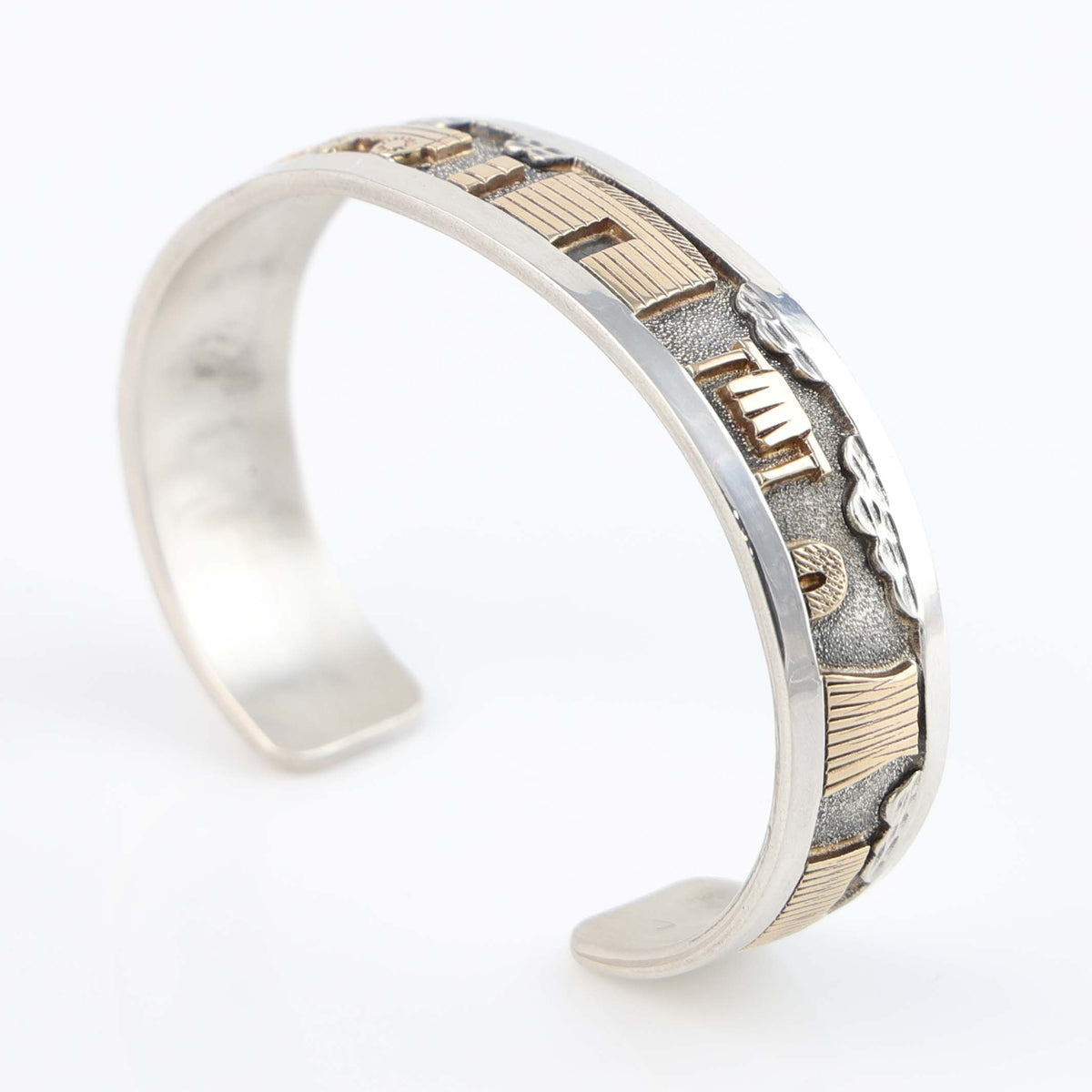 Gold on Silver Navajo Storyteller Cuff by Roland Begay