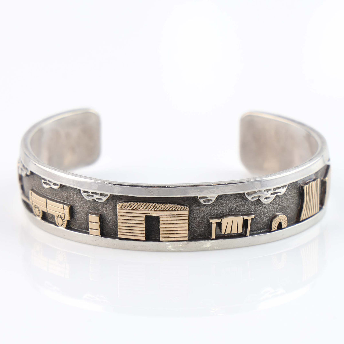 Gold on Silver Navajo Storyteller Cuff by Roland Begay