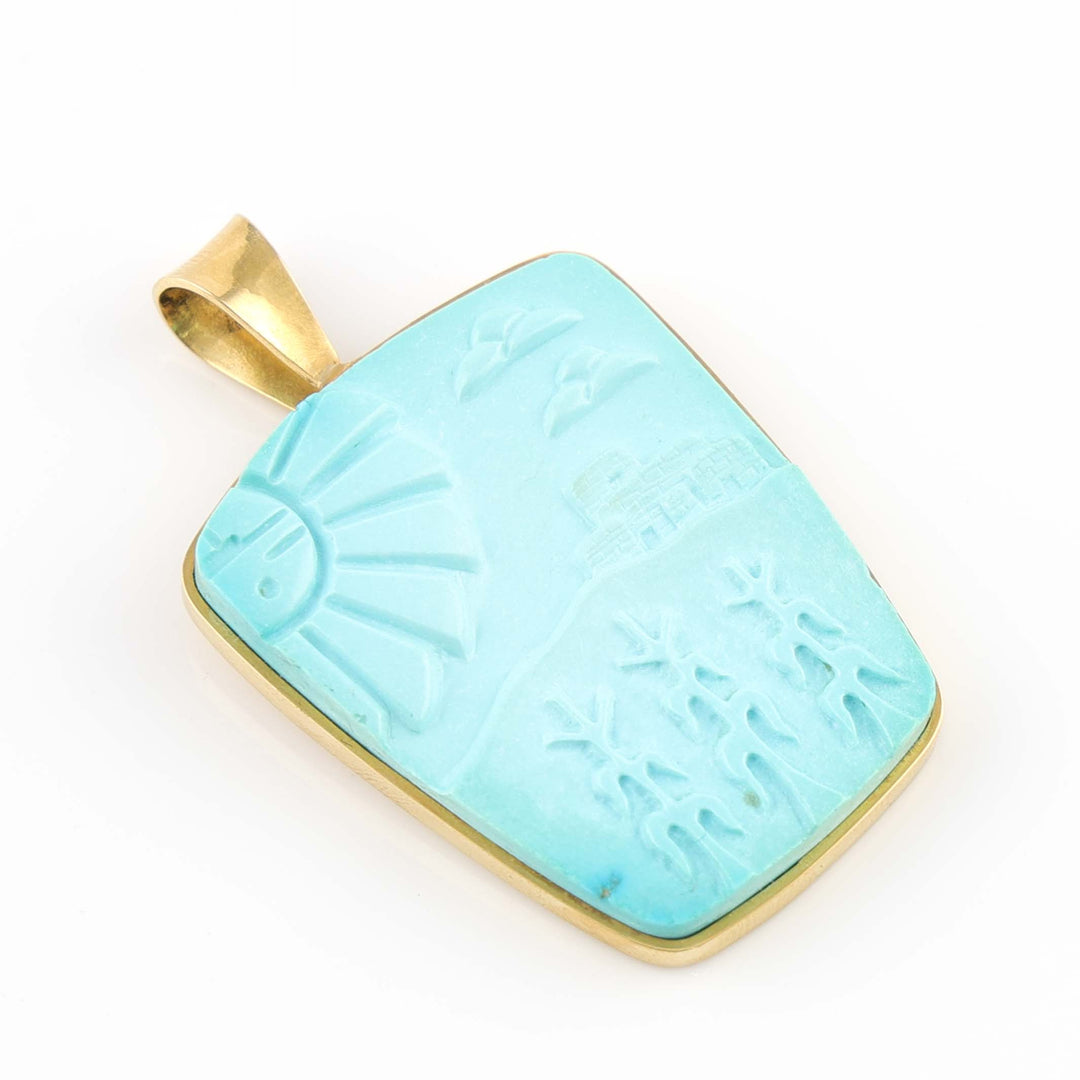 Carved Turquoise and Gold Pendant