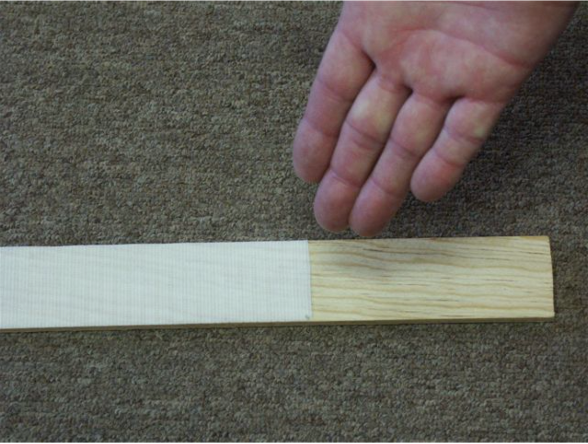 Velcro hook tape pressed onto a thin wood lattice strip